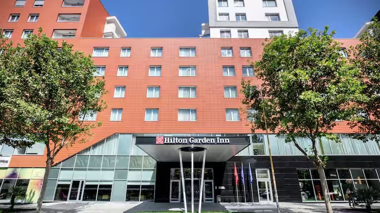 The Hilton Garden Inn Tirana — the facade with the hotel sign