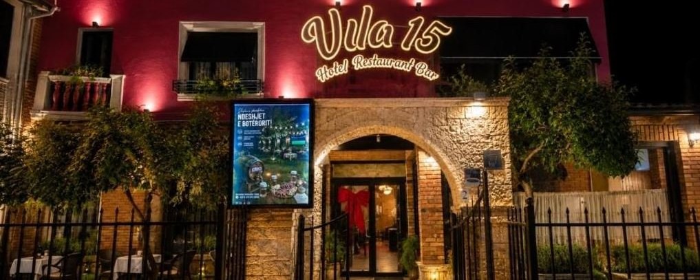 The facade of Vila 15 at night — hotel, restaurant and bar in Tirana