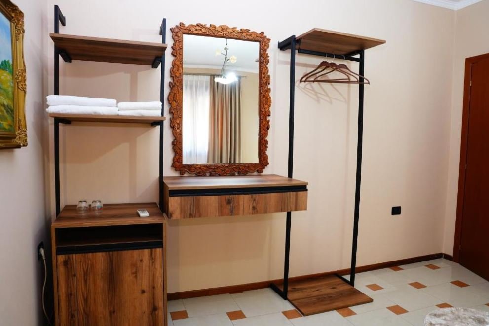 Room detail at Vila 15 — mirror and wardrobe